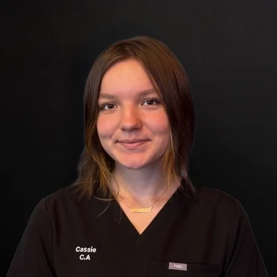 Chiropractic Delano MN Cassie W. Meet The Team Cassie smiling in a black shirt.