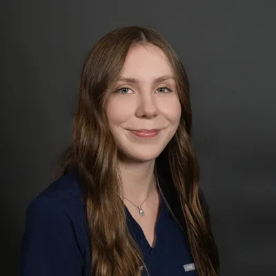 Maddy K smiling Office Manager at Delano Chiropractic